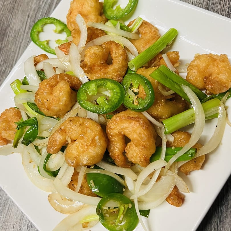 Golden Pho's salt and pepper shrimp with sliced onions, green onions, and jalapeños.